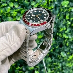 used tudor watches​ Tudor Black Bay 58 GMT Coke Black Red Bezel Angled View